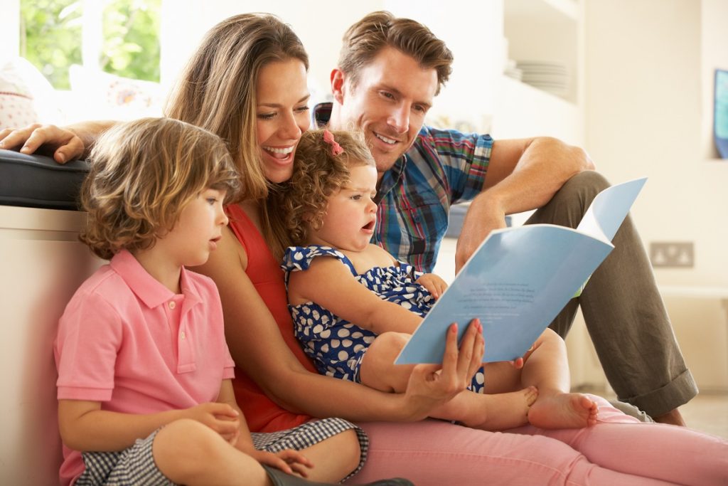 family reading a book